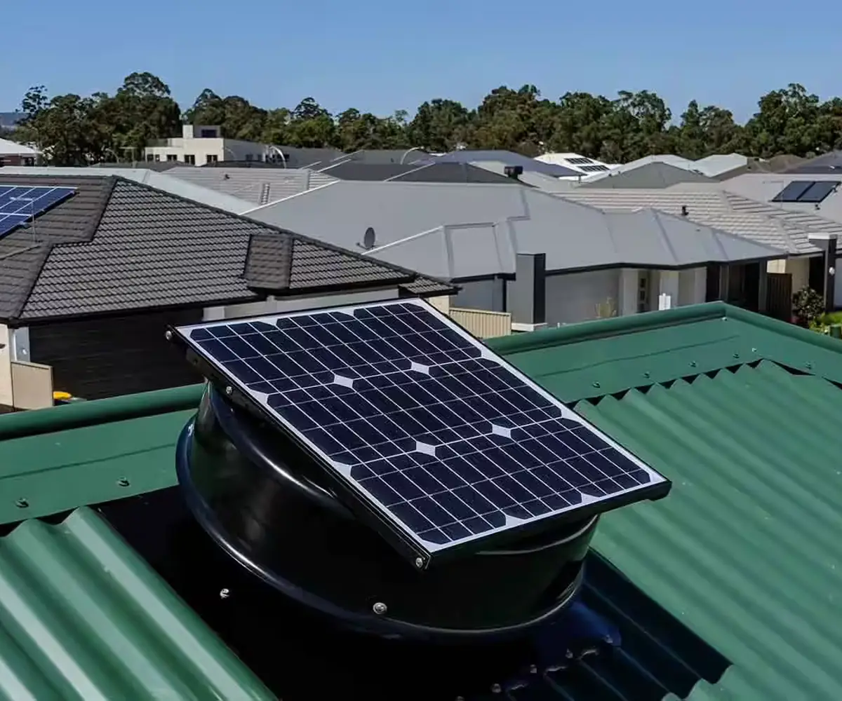 Solar-powered roof ventilation fan installed on a tiled roof